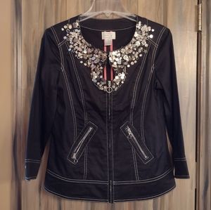 Small cotton jacket with silver bling around neck.